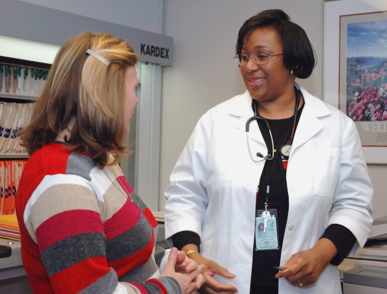 Clinician reviewing a care plan with a patient during a consultation