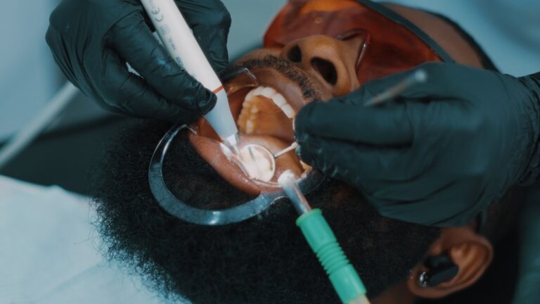 Dentist performing deep cleaning and scaling on a patient's teeth