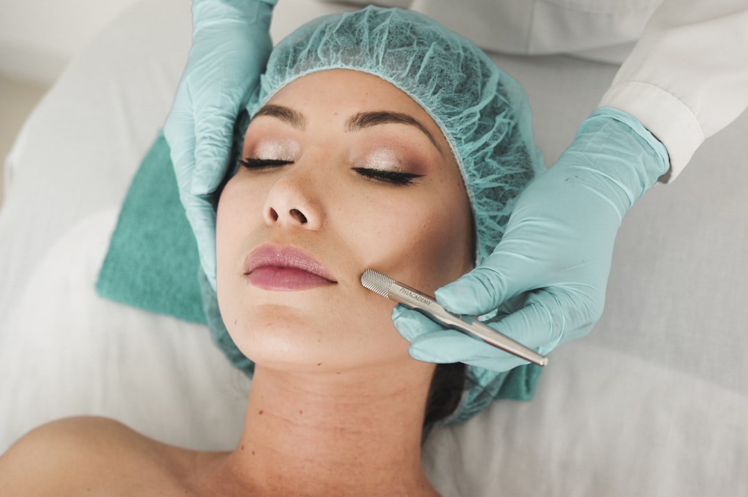 Dermatologist examining patient