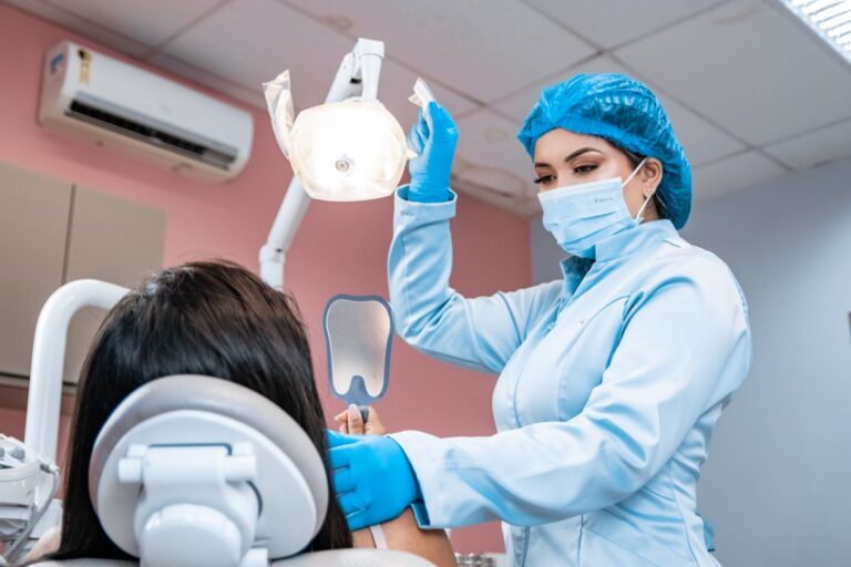 Woman having her teeth checked by a dentist during an examination