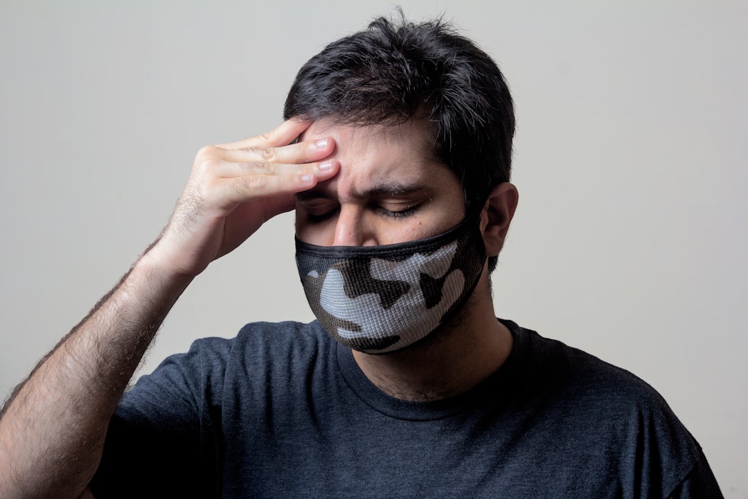 Man feeling unwell with a headache