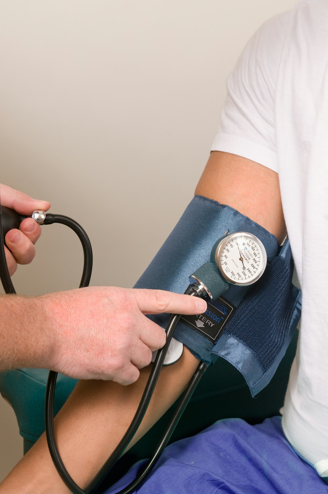 Medical assistant taking a patient's blood pressure