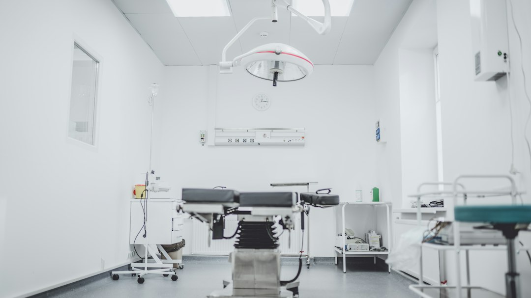 Medical assistant preparing an exam room