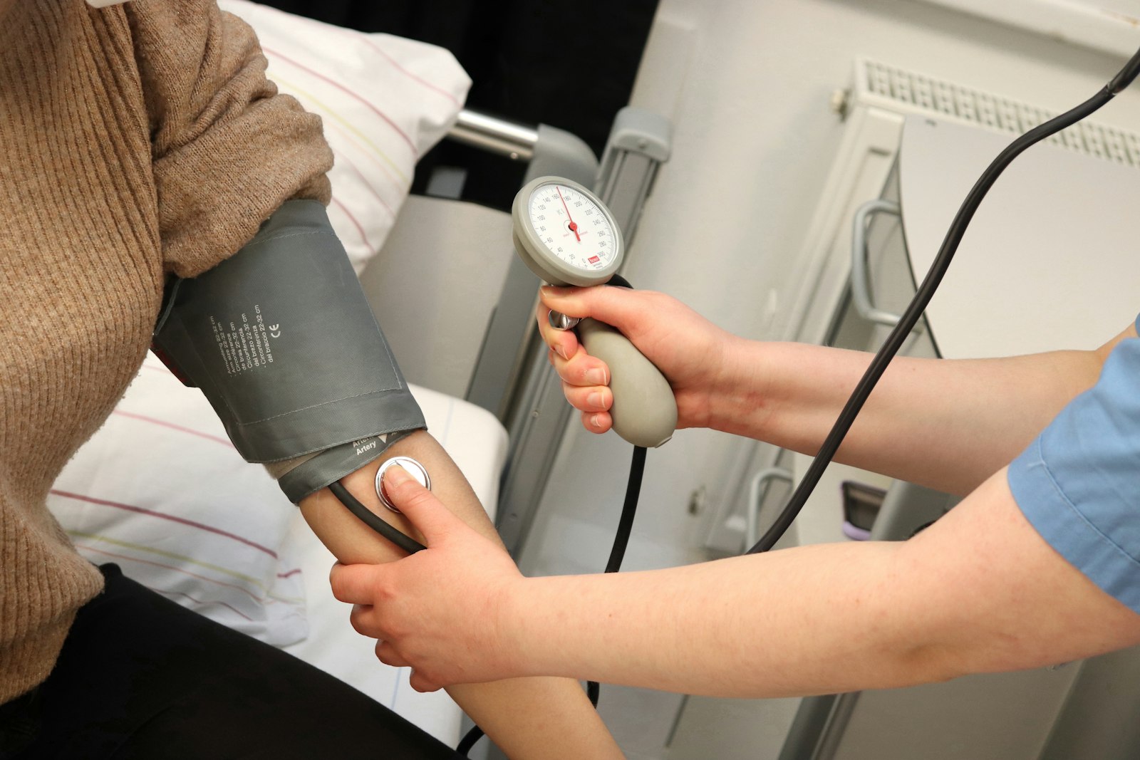 Medical assistant checking a patient’s vitals