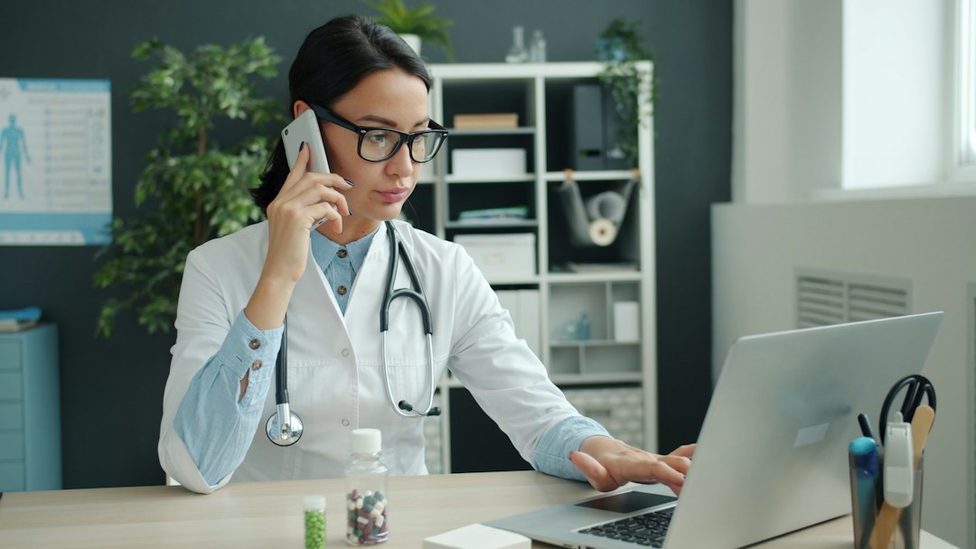 Medical receptionist answering the phone