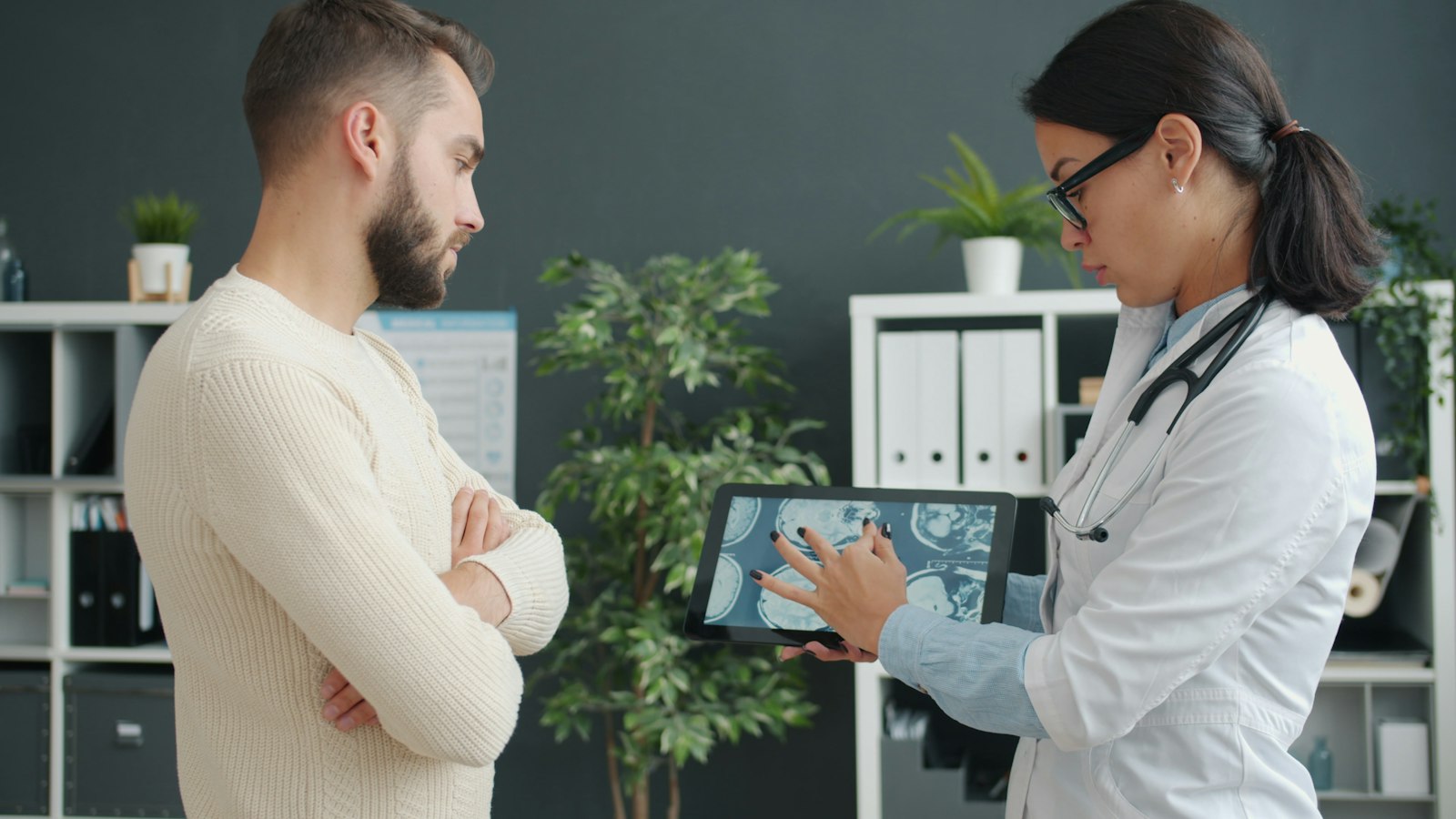 Physician reviewing a medical scan with a patient