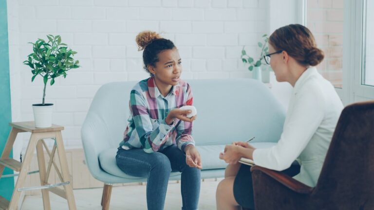 Client talking with a counselor during a supportive session addressing problems with addiction