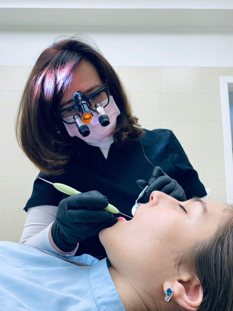 Dental hygienist performing a regular teeth cleaning
